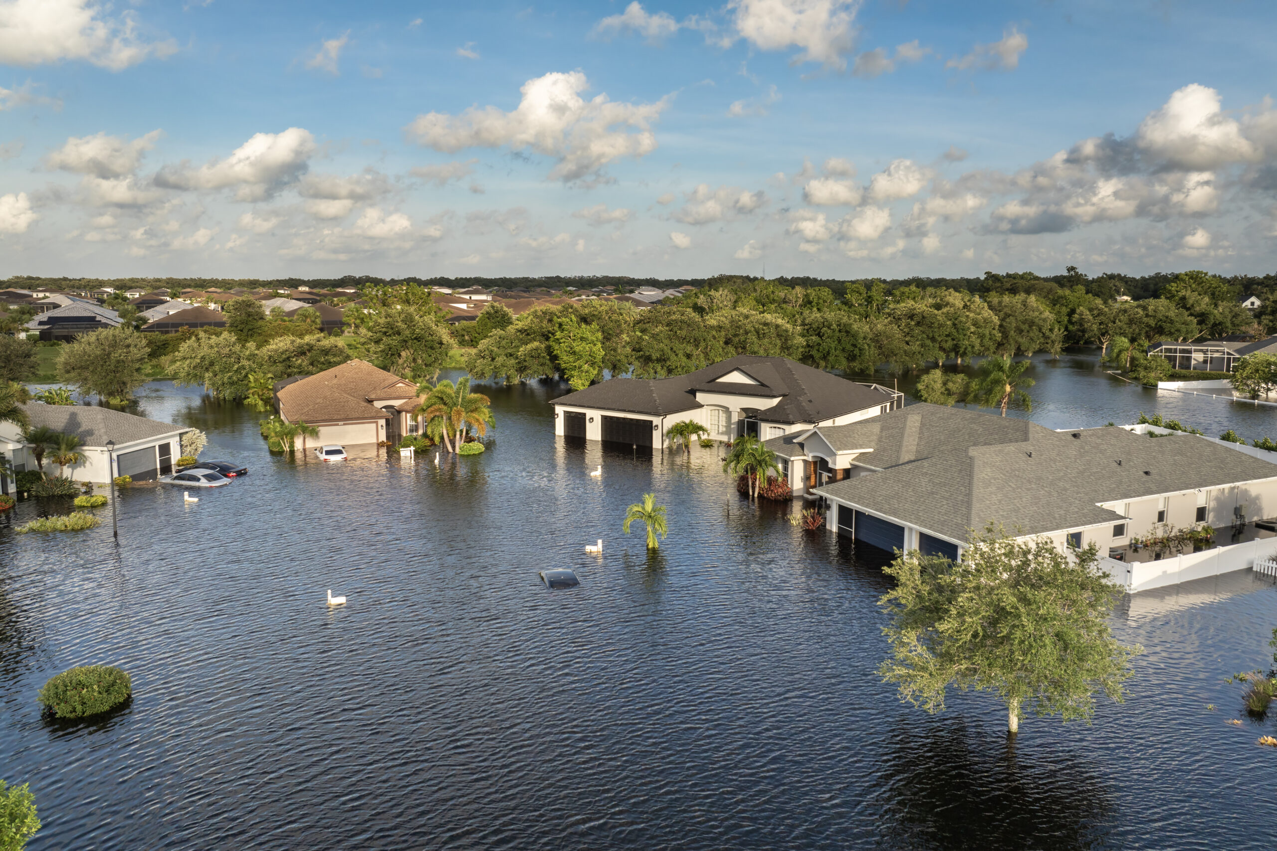 Neighborhood houses surrounded by floodwater after heavy rainfall