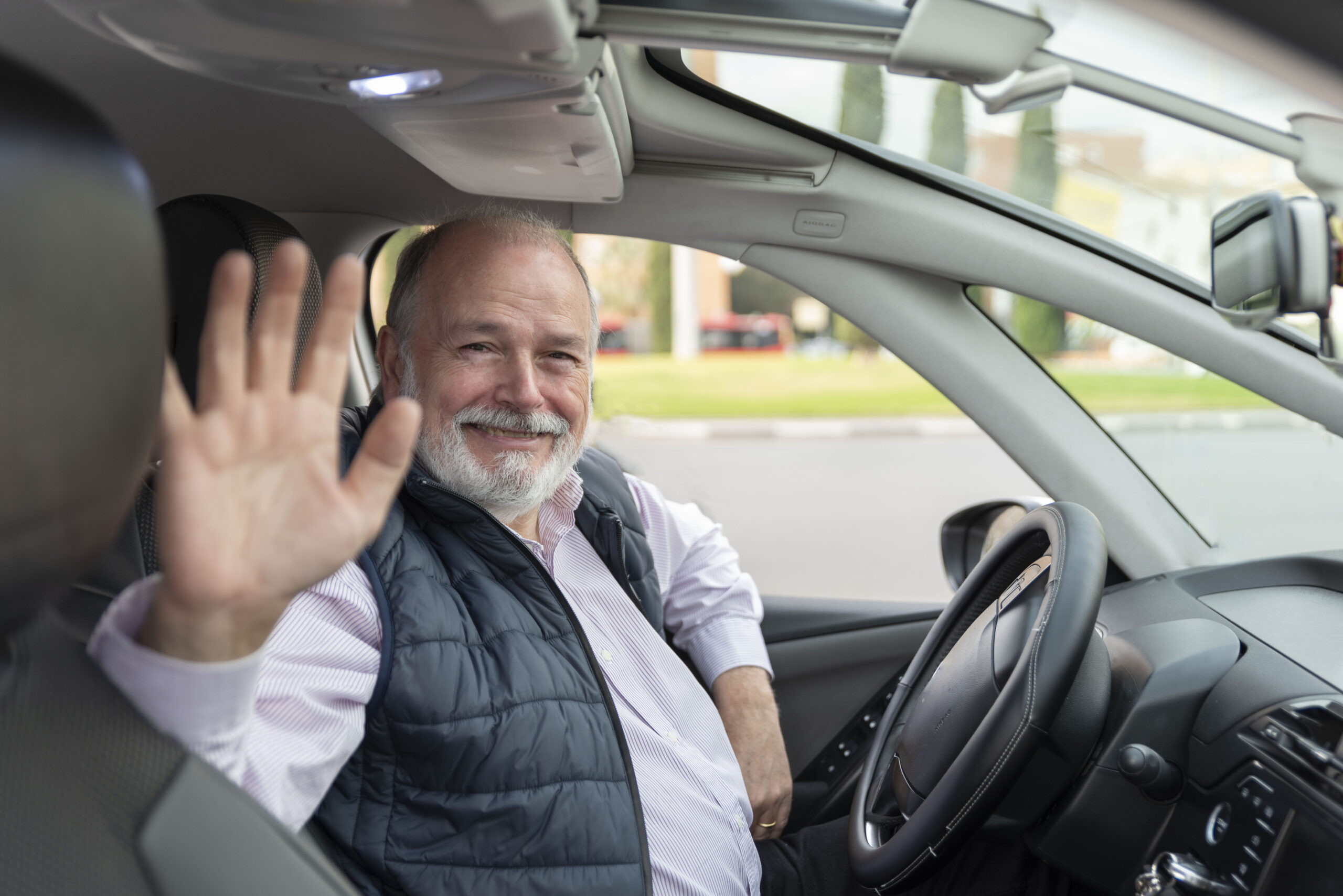 uber driver waiving his hand