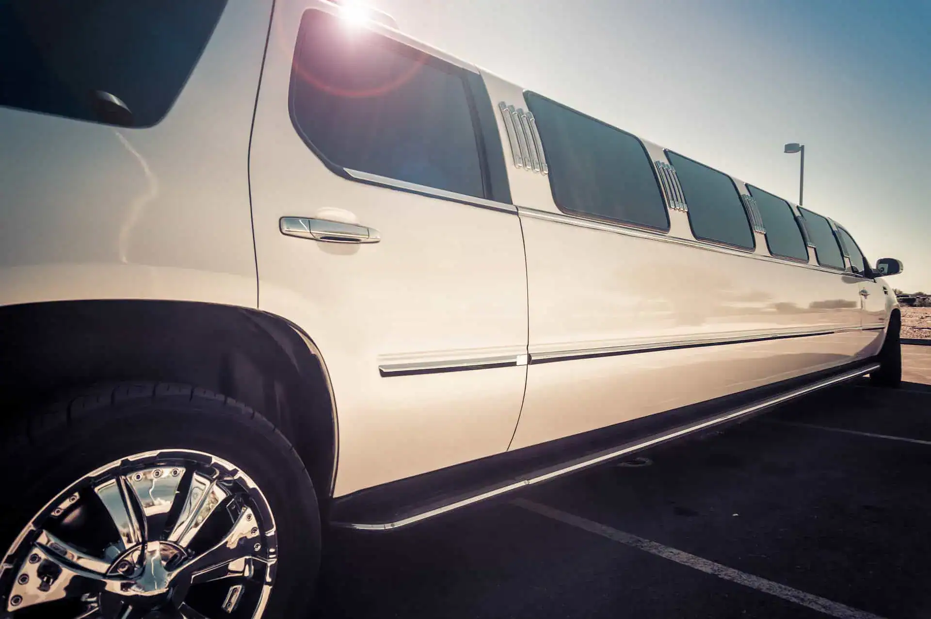 White stretch limousine parked outdoors, representing luxury transportation, chauffeur services, and commercial limo insurance coverage.