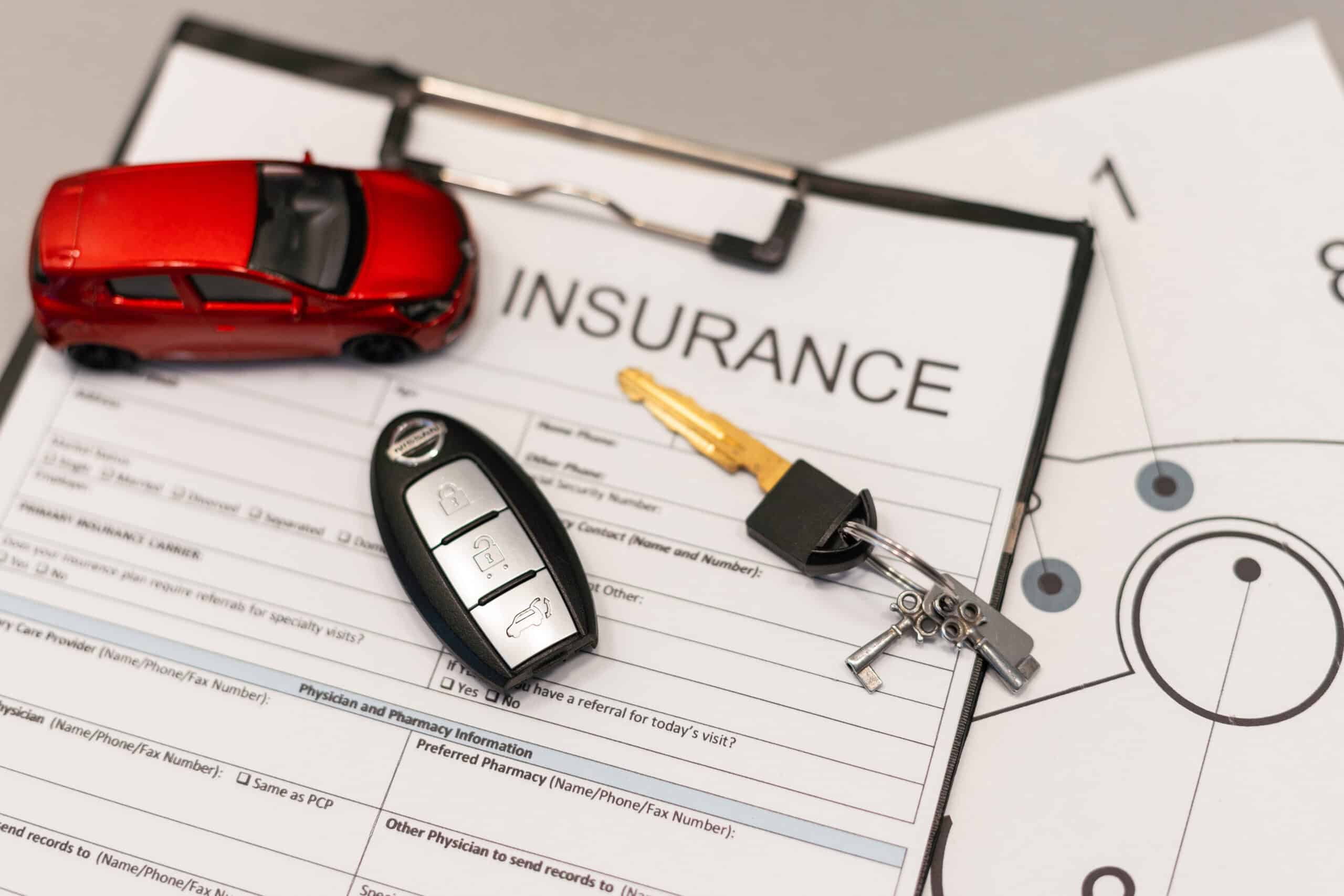 Insurance advisor reviewing affordable auto insurance options with South Miami Heights drivers in a bright South Florida office setting.