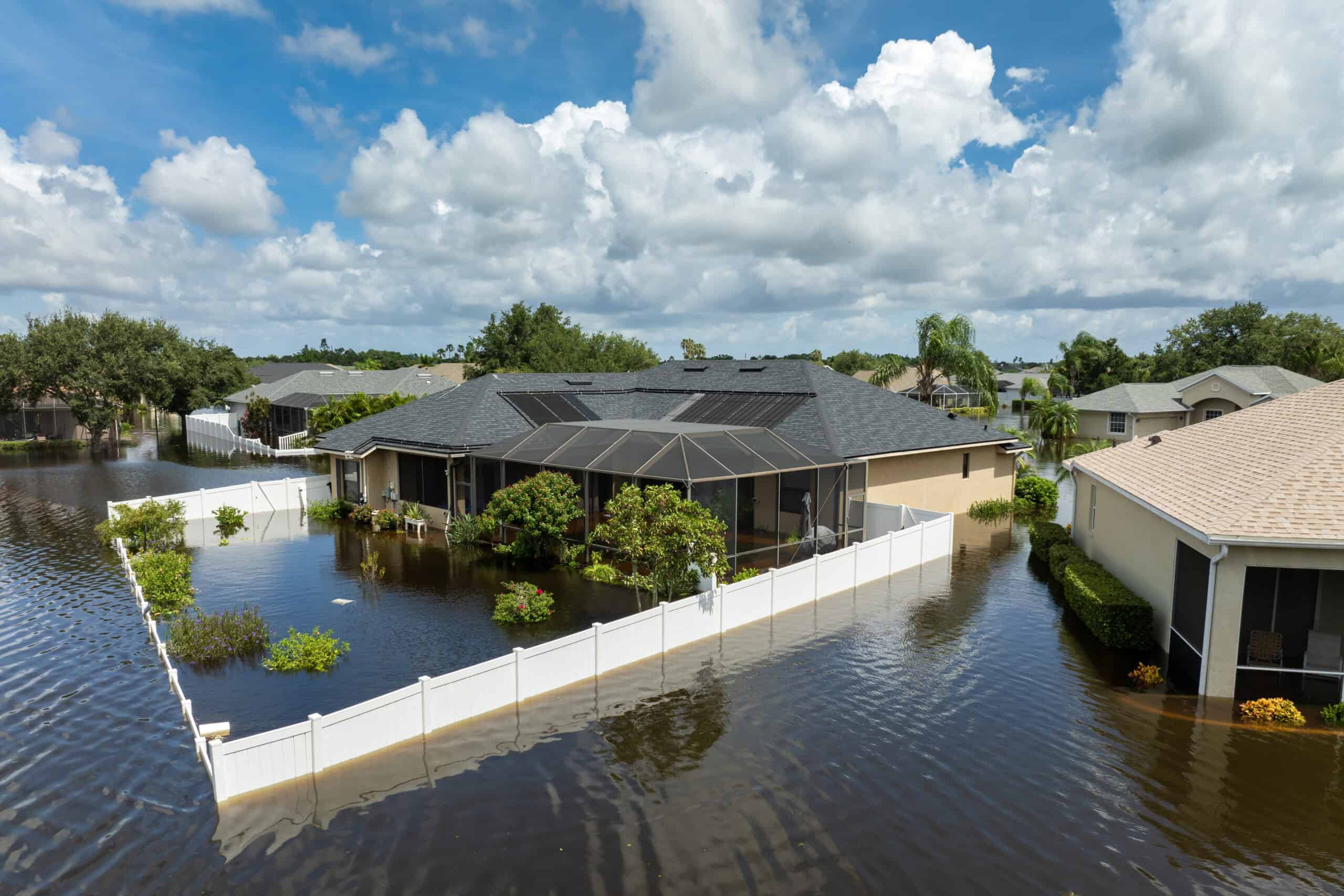 Pinecrest property owner reviewing flood insurance documents at home