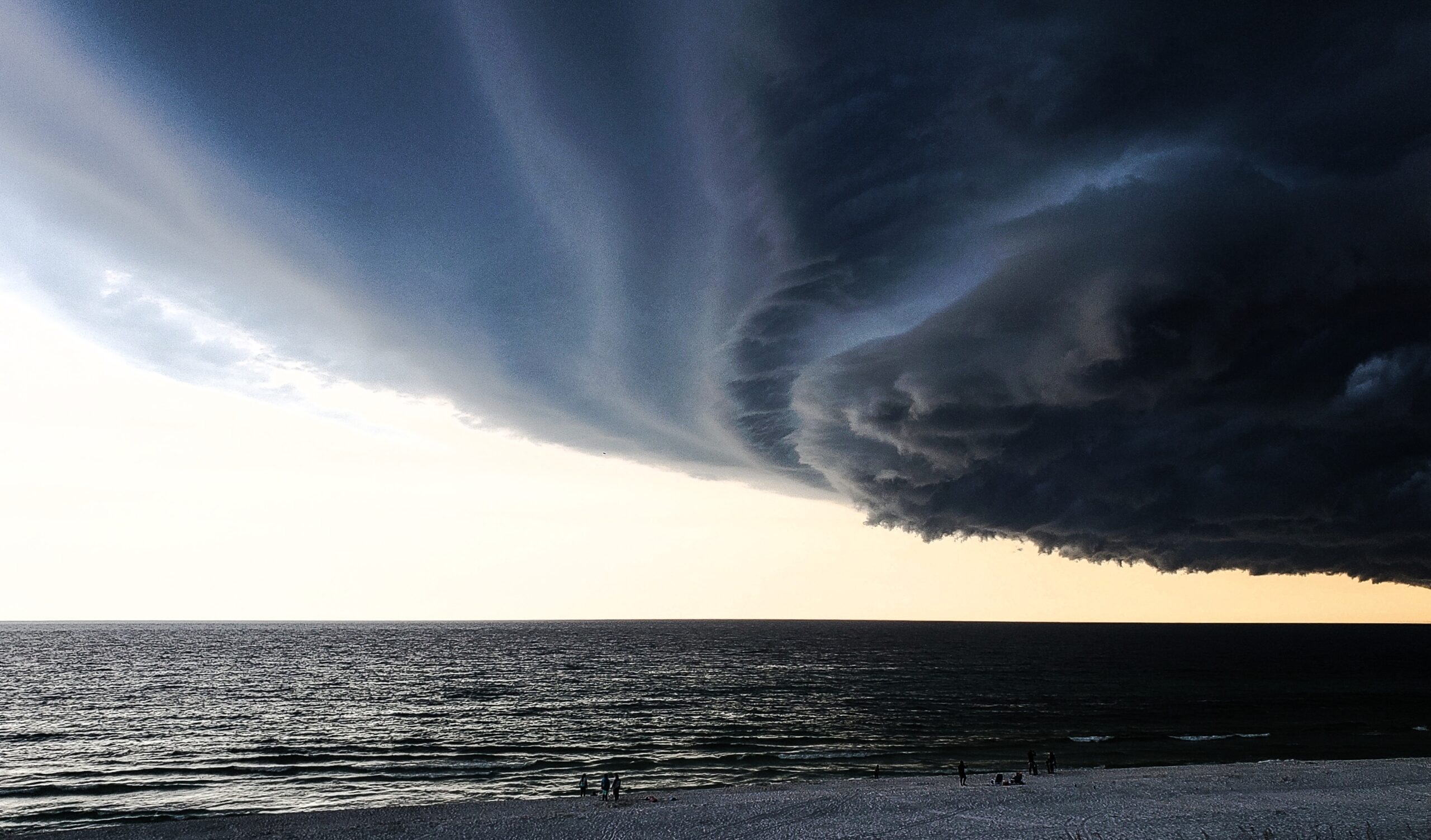 Dark storm clouds and severe hurricane weather approaching homes in Miami, Florida